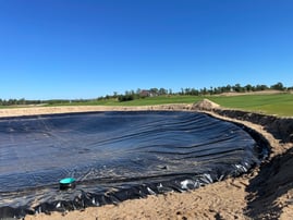 Pond liner being installed in a site with sandy or porous soil conditions.