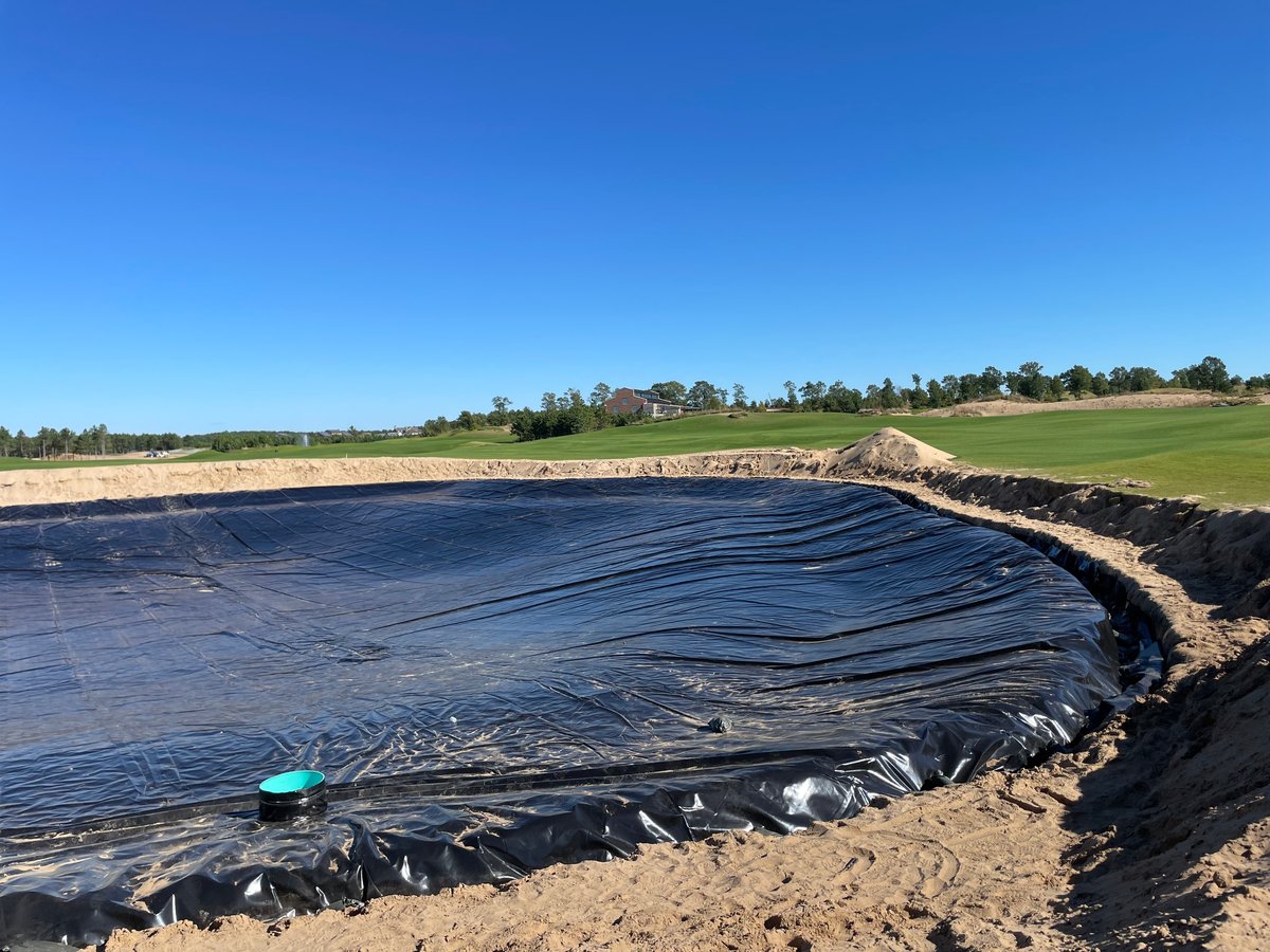 Pond liner being installed in a site with sandy or porous soil conditions.