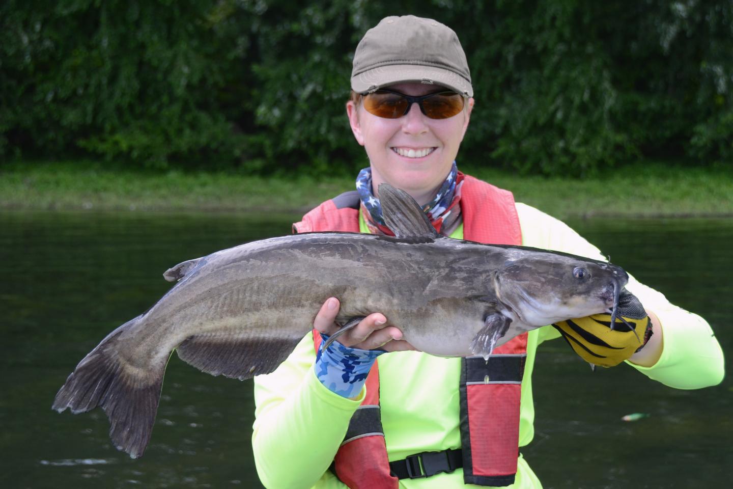 Angler holding a large channel catfish