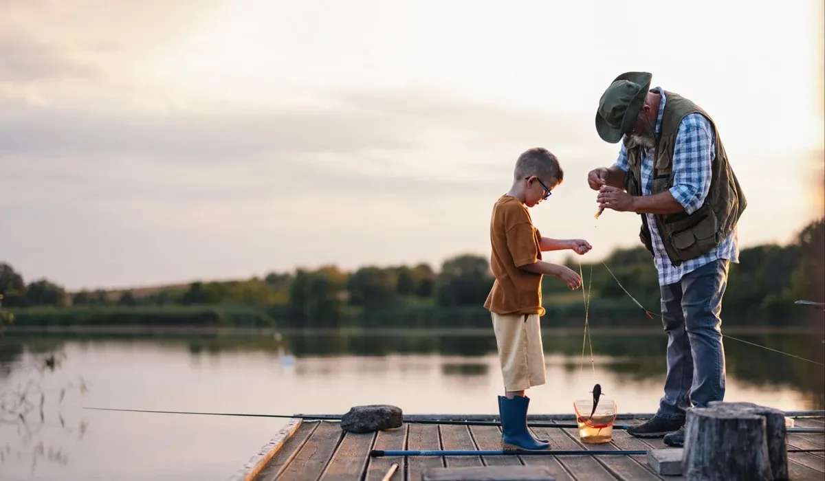 Grandfather and Grandson Fishing on a Dock